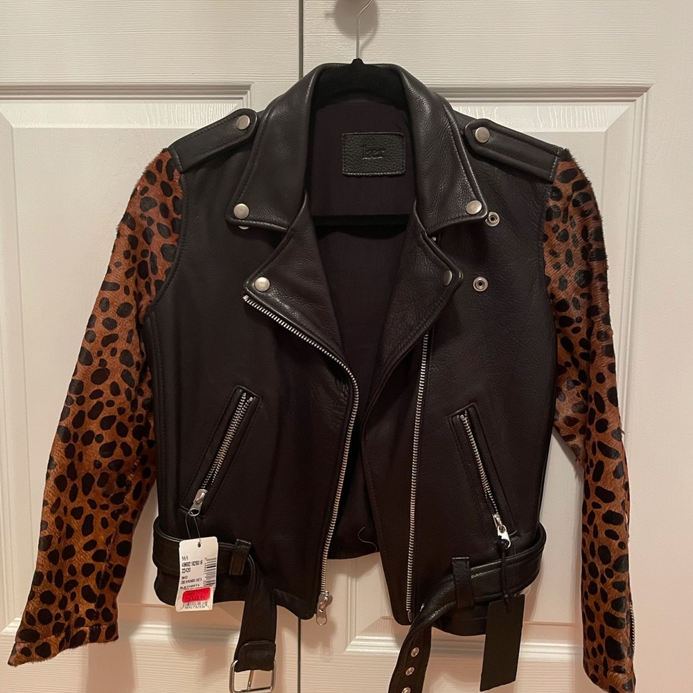 Leather jacket with cheetah sleeves